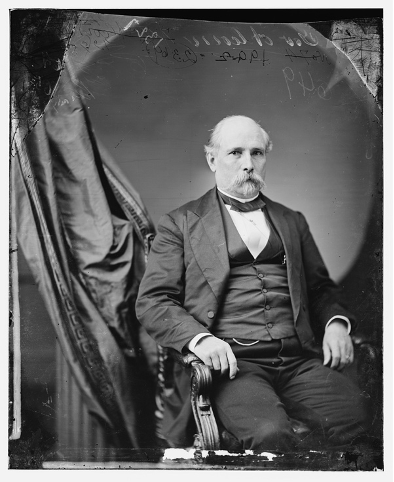 Black and white photograph of Mississippi Governor James L. Alcorn seated in a chair and facing the camera.